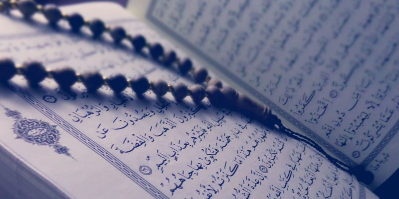 Quran with a rosary to signify the importance of islamic wills in durham region