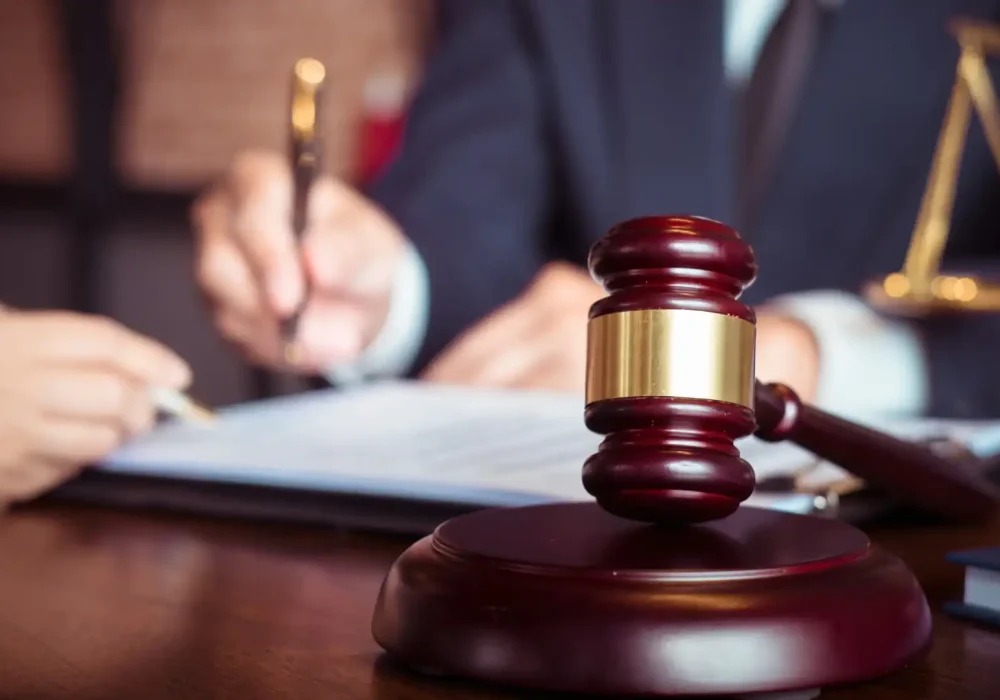 A lawyer signing a document in their office
