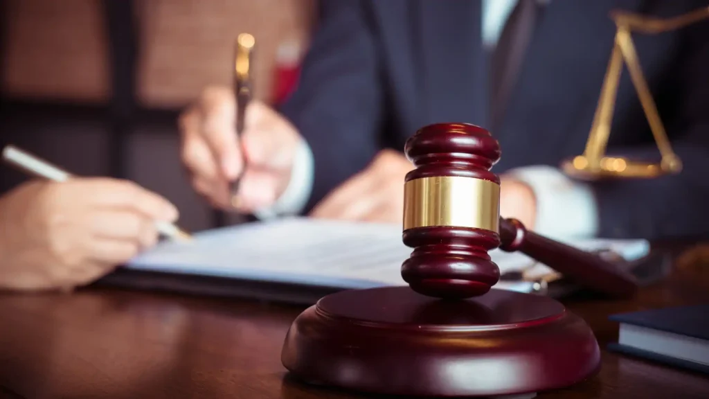 A lawyer signing a document in their office