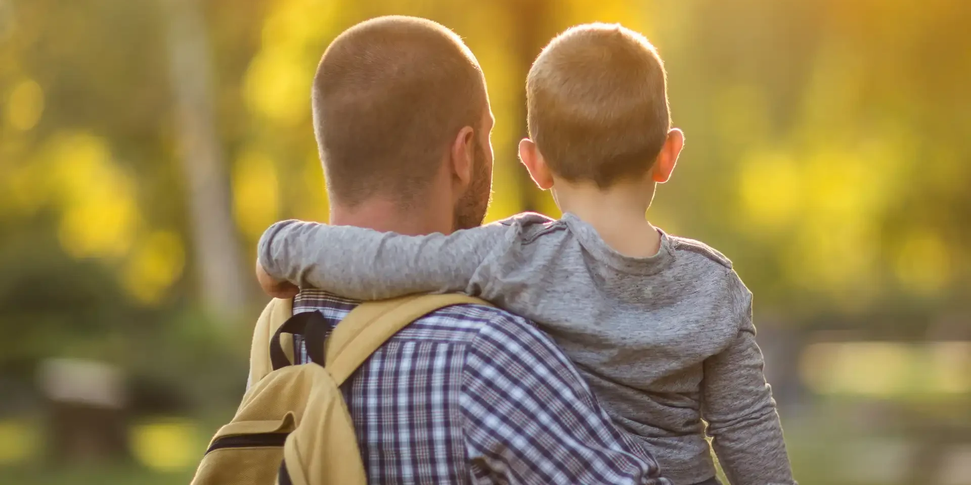 photo of a parent and son clicked from backside