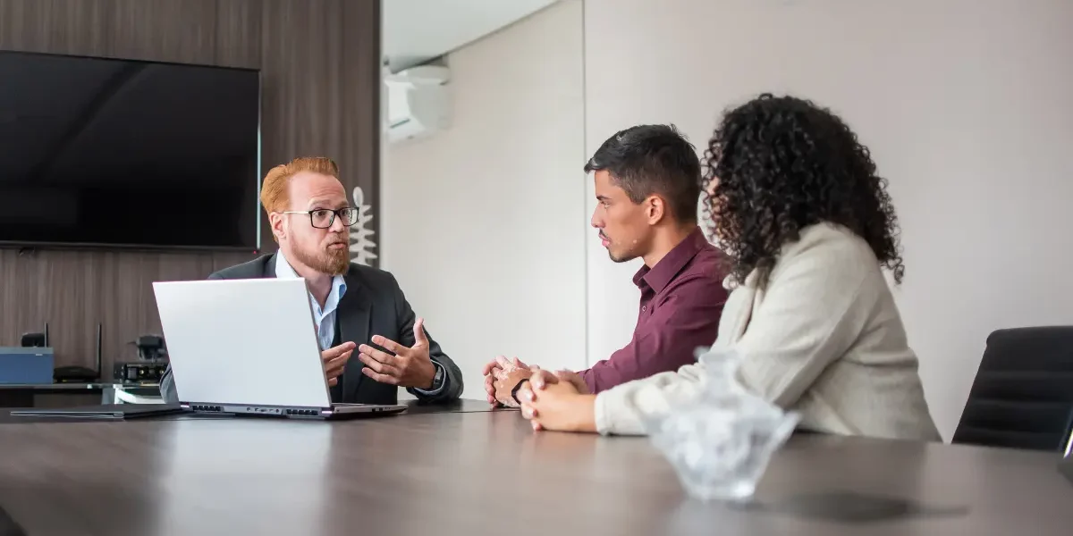 Family lawyer discussing asset protection and property division with a couple.