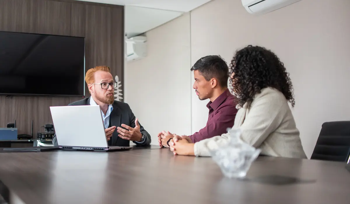 Family lawyer discussing asset protection and property division with a couple.