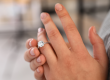 Person showing an engagement ring on their finger